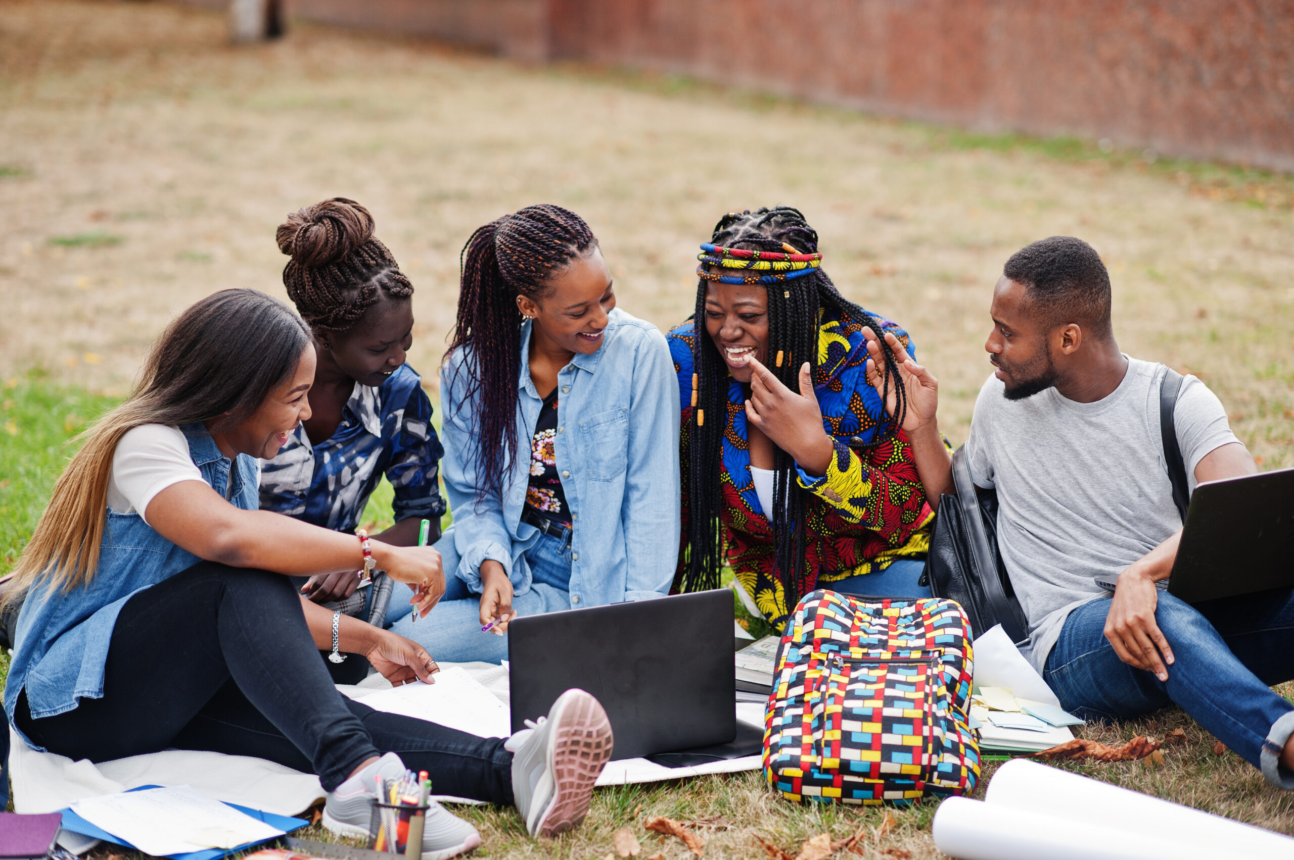 Group of five african college students spending time together on - Africans Rising