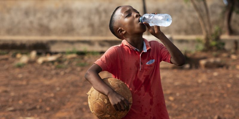 medium-shot-boy-drinking-water